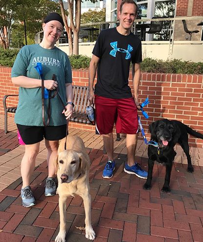 Dogtors Moose and Nessie take a walk with Drs. Joeleen and Dustin
